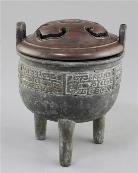 A Chinese archaic bronze tripod ritual food vessel, Ding, Qing dynasty., 17cm high, 14cm wide